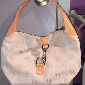 Dooney and Bourke satchel with gold hardware. New